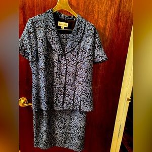 Two piece blue design with black background.  Top and skirt